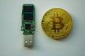 Bitcoin coin and green microchip on white background Royalty Free Stock Photo