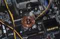 Bitcoin coin inside the computer system unit. blockchain Royalty Free Stock Photo