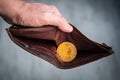 bitcoin coin in the leather brown wallet. e-Commerce concept. Making money on mining. Male hands holding a purse. Male manners and Royalty Free Stock Photo