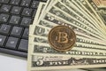 Bitcoin coin with US dollars and computer keyboard Royalty Free Stock Photo