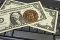 Bitcoin coin with US dollars and computer keyboard Royalty Free Stock Photo