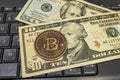 Bitcoin coin with US dollars and computer keyboard Royalty Free Stock Photo