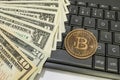 Bitcoin coin with US dollars and computer keyboard Royalty Free Stock Photo