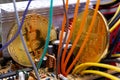 Bitcoin coins, colorful cables and printed circuit board PCB