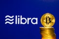 Bitcoin Coins with the Facebook Libra Crypto Coin logo