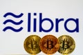 Bitcoin Coins with the Facebook Libra Crypto Coin logo