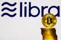 Bitcoin Coins with the Facebook Libra Crypto Coin logo
