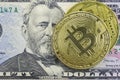 Bitcoin coins lie on a fifty dollar bill Royalty Free Stock Photo