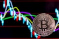 Bitcoin with colorful charts in the background