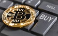 Bitcoin and computer keyboard Royalty Free Stock Photo