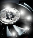 Bitcoin on cooling computer fan background Royalty Free Stock Photo