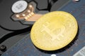 Bitcoin criptocurrency coin on hard disk drive Royalty Free Stock Photo