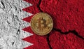 Bitcoin crypto currency coin with cracked Bahrain flag. Crypto restrictions
