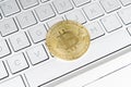 Bitcoin crypto currency. Gold bitcoin and computer keyboard. Golden digital cryptocurrency coin. Electronics finance money symbol Royalty Free Stock Photo