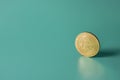 Bitcoin cryptocurrency coin on green background with copy space