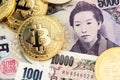 Bitcoin cryptocurrency coins on Japanese Yen. Royalty Free Stock Photo