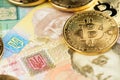 Bitcoin BTC cryptocurrency and Ukraine Hryvnia national currency. Royalty Free Stock Photo