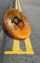 Bitcoin cryptocurrency on double yellow lines parking