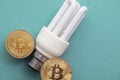 Bitcoin cryptocurrency eco sustainability concept. coin with light bulb Royalty Free Stock Photo