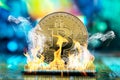 Bitcoin cryptocurrency in the form of a coin burns on fire on a microchip. Concept of death blockchain