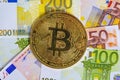 Bitcoin cryptocurrency. Golden bitcoin on euro banknotes background. Bitcoin crypto currency, Blockchain technology, digital money Royalty Free Stock Photo