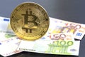 Bitcoin cryptocurrency. Golden bitcoin on euro banknotes background. Bitcoin crypto currency, Blockchain technology, digital money Royalty Free Stock Photo