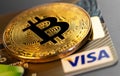 bitcoin cryptocurrency and Visa plastic electronic card