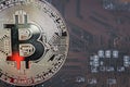 Golden silver crypto currency coin on motherboard. Shiny closeup crypto-currency coin background. Electronic money, cryptocurrency Royalty Free Stock Photo