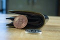 Bitcoin digital currency instead real money, bit-coin with leather wallet or purse on wooden working table, virtual Royalty Free Stock Photo