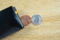 Bitcoin digital currency instead real money, bit-coin with leather wallet or purse on wooden working table, virtual Royalty Free Stock Photo