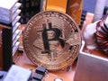 Bitcoin in front of electronic parts and coolers Royalty Free Stock Photo