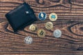 Bitcoin and ethereum lie in black wallet on wooden background Royalty Free Stock Photo