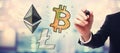 Bitcoin, Ethereum and Litecoin with businessman