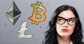 Bitcoin, Ethereum and Litecoin with young businesswoman Royalty Free Stock Photo