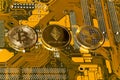 Bitcoin, Ethereum, Ripple coins on computer motherboard, cryptocurrency investing concept Royalty Free Stock Photo