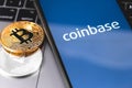 Bitcoin, ethereum and smartphone with Coinbase logo on the screen Royalty Free Stock Photo