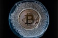 Bitcoin frozen inside ice cube, Bitcoin price crisis concept. Neural network generated art Royalty Free Stock Photo