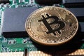 Bitcoin. Gold Bitcoin electronic computer board Royalty Free Stock Photo