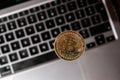 Bitcoin gold coin on keyboard of laptop Mining trading concept. BTC golden money. Worldwide virtual internet Royalty Free Stock Photo