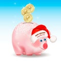 Bitcoin gold coins falling into money pig bank. Merry Christmas and Happy New Year congratulation on Santa Claus red hat. Conceptu Royalty Free Stock Photo