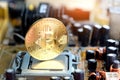 Bitcoin Gold is placed on the CPU processor in the socket and slot motherboard computer. Background, line graph, financial
