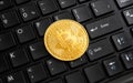 Bitcoin golden coin on black computer keyboard Royalty Free Stock Photo