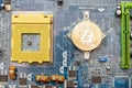 Bitcoin golden coin on computer chip.