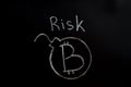 Bitcoin inscription with white chalk on a black board