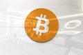 Bitcoin on glossy office wall realistic texture