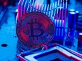 Bitcoin lies on the desktop of a personal computer processor. Virtual money, cryptocurrency, mining, crypto farm, cyberspace, Royalty Free Stock Photo