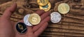 Bitcoin, litecoin and ethereum lie on mans hand closeup