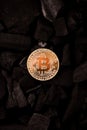 Bitcoin mining concept. Bitcoin cuurency on charcoal Royalty Free Stock Photo