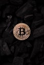 Bitcoin mining concept. Bitcoin cuurency on charcoal Royalty Free Stock Photo