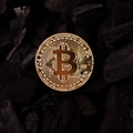 Bitcoin mining concept. Bitcoin cuurency on charcoal Royalty Free Stock Photo